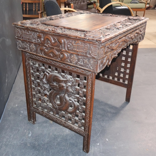 2001B - A 19th century Chinese hardwood folding travelling scribe's desk, with profuse dragon and character ... 