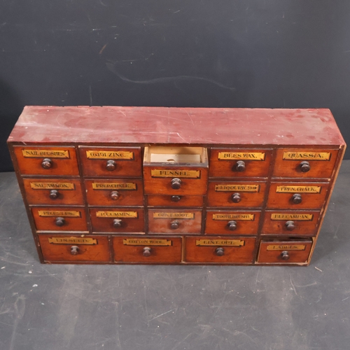 2001 - A 19th Century Apothecary cabinet in pine and mahogany, with eighteen drawers and hand painted decor... 