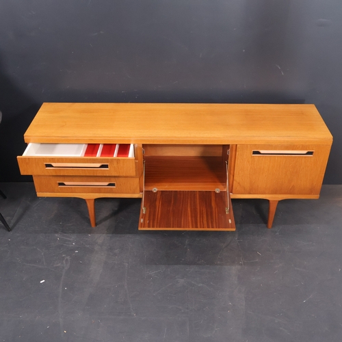2002 - A Mid Century teak veneered Sideboard on legs by Elliots of Newbury. W180cm, H72cm, D44cm.