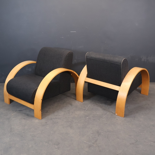 2015 - A pair of 1990s post modern Art Deco style lounge chairs with one piece broad bent ply arms.