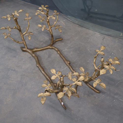 2016 - A mid-century coffee table, the bevelled oval glass top on cast bronze base in the form of branches ... 