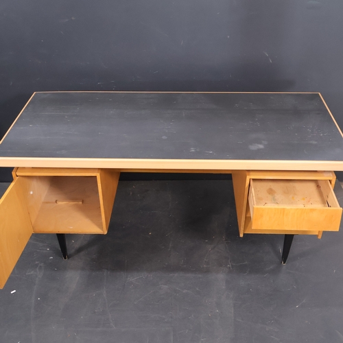 2019 - A Mid Century beech kneehole writing desk with detachable top and painted legs and top panel.