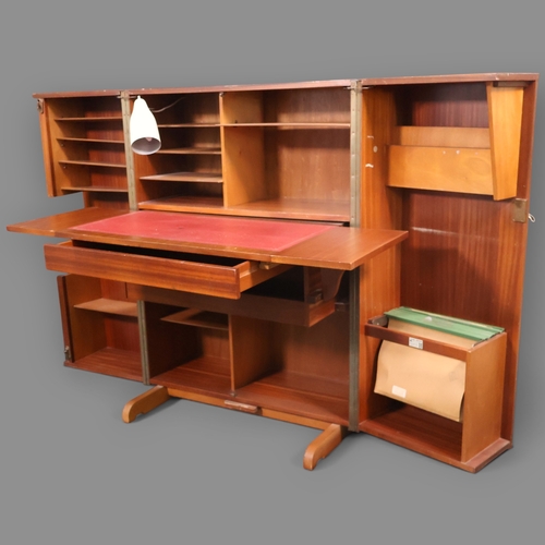 2024 - A Mid Century teak veneered Metamorphic Home office cabinet by Newcraft Ltd with interior fitted she... 