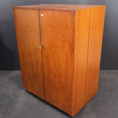 2024 - A Mid Century teak veneered Metamorphic Home office cabinet by Newcraft Ltd with interior fitted she... 