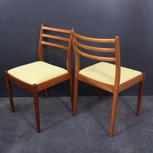 2026 - A set of four Mid Century teak Dining chairs with drop in lime green upholstered seats by G Plan.