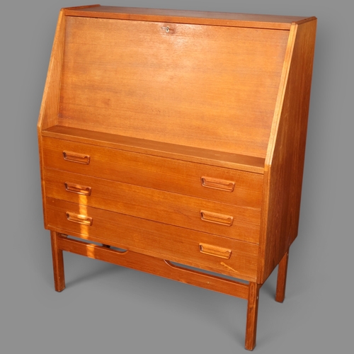 2028 - A Mid Century Danish teak veneered writing desk with writing slope, three exterior drawers and two i... 