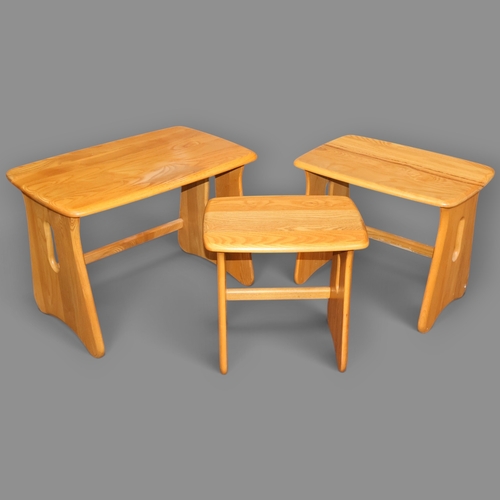 2030 - A Contemporary Ercol Windsor nest of three tables in solid ash in light finish. W64cm, H45cm, D41cm.