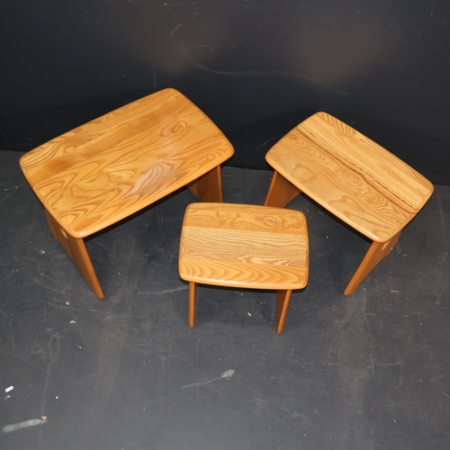 2030 - A Contemporary Ercol Windsor nest of three tables in solid ash in light finish. W64cm, H45cm, D41cm.