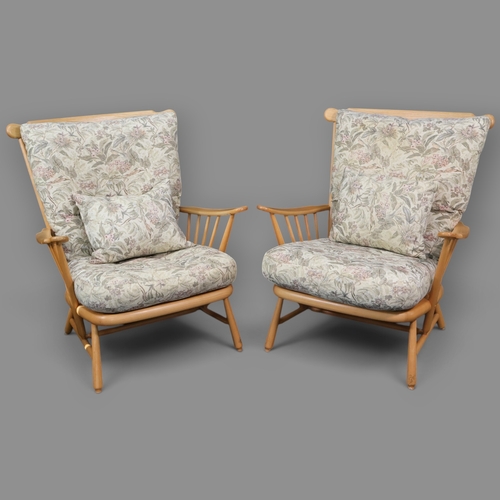 2031 - A pair of contemporary Ercol blonde armchairs in solid ash with floral cushions with light finishes ... 