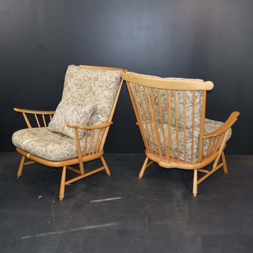 2031 - A pair of contemporary Ercol blonde armchairs in solid ash with floral cushions with light finishes ... 