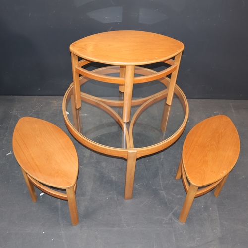 2054 - A Mid Century teak 'Trinity' teardrop circular glass topped coffee table with three ovular teak topp... 