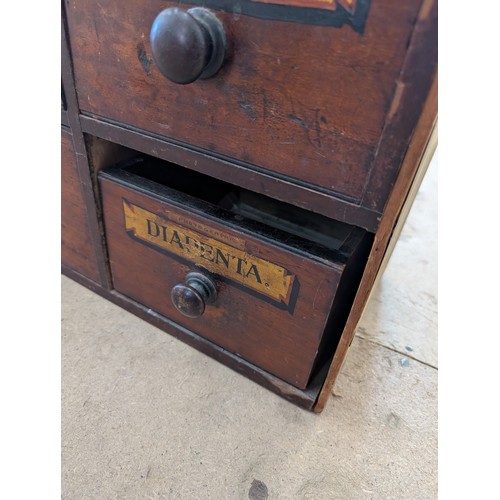 2001 - A 19th Century Apothecary cabinet in pine and mahogany, with eighteen drawers and hand painted decor... 