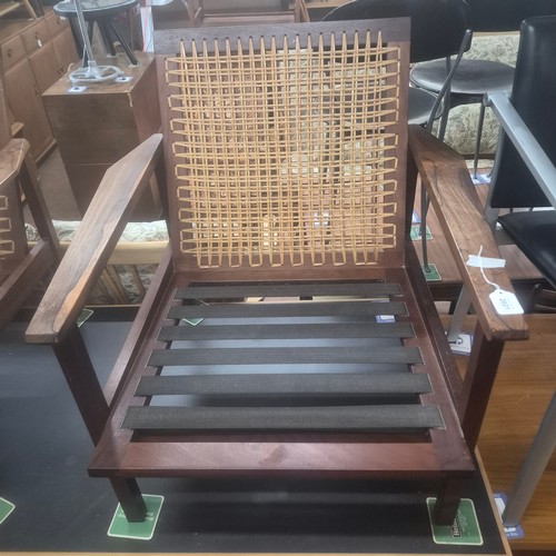 2021 - A Pair of Brazilian Rosewood custom made Lounge chairs with mesh webbing and cane threaded backrests... 