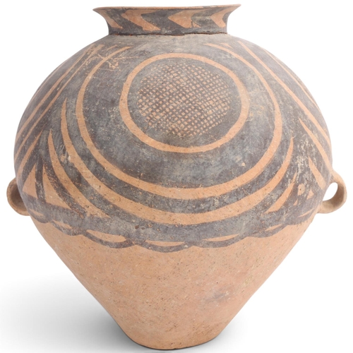 A large Chinese Neolithic Period terracotta jar, Banshan type, third millennium BC, height 35cm