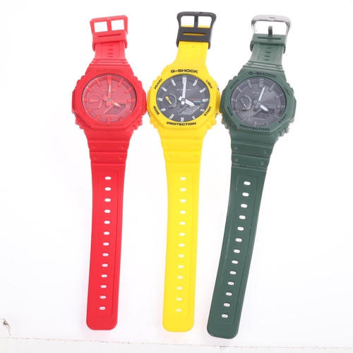 1038 - 3 Casio G-Shock quartz wristwatches, ref. GA-V2100, comprising yellow green and red, all working ord... 