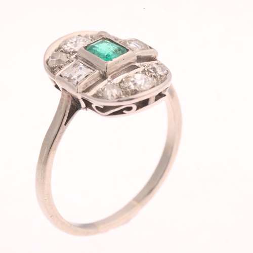 1106 - An Art Deco emerald and diamond cluster ring, the oval openwork panel set with 0.25ct octagonal step... 