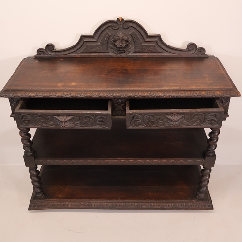 A Victorian oak three-tier buffet, with raised back, carved lion mask ...