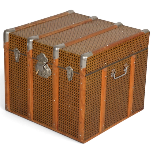 A 1950s' trunk, with tin coating in wicker form, hardwood strapping and ...