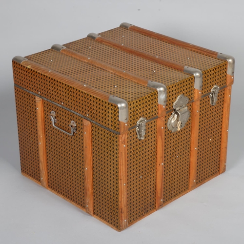 A 1950s' trunk, with tin coating in wicker form, hardwood strapping and ...