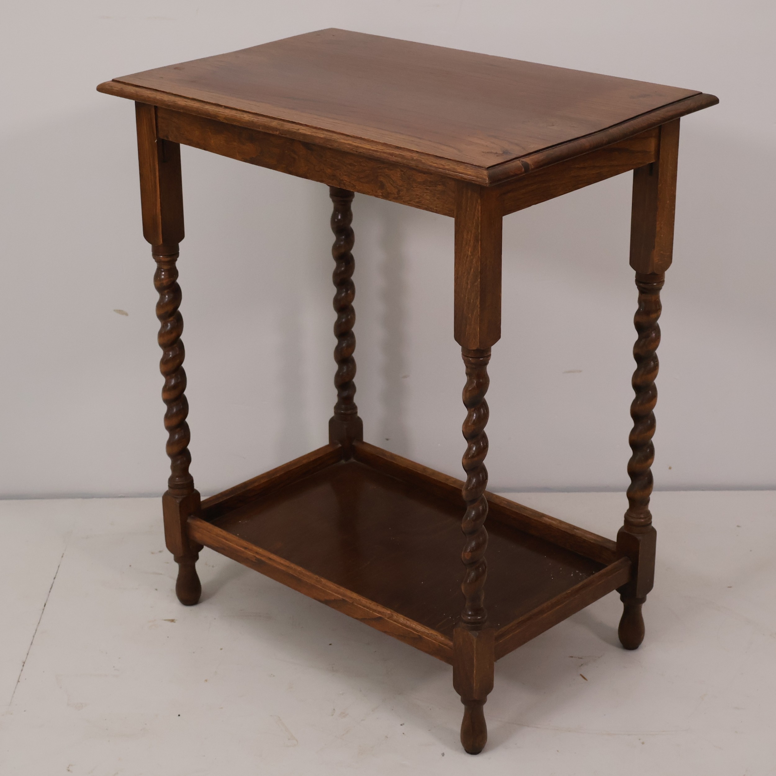 A late Victorian oak two-tier side / lamp table with barley-twist ...