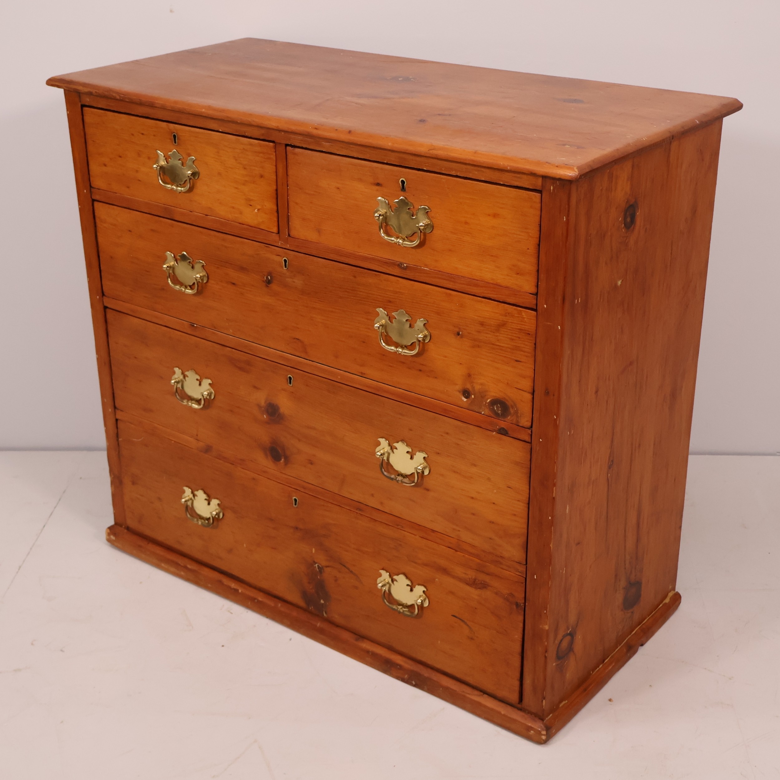 A Victorian pine chest of two short and three long drawers. W98cm ...