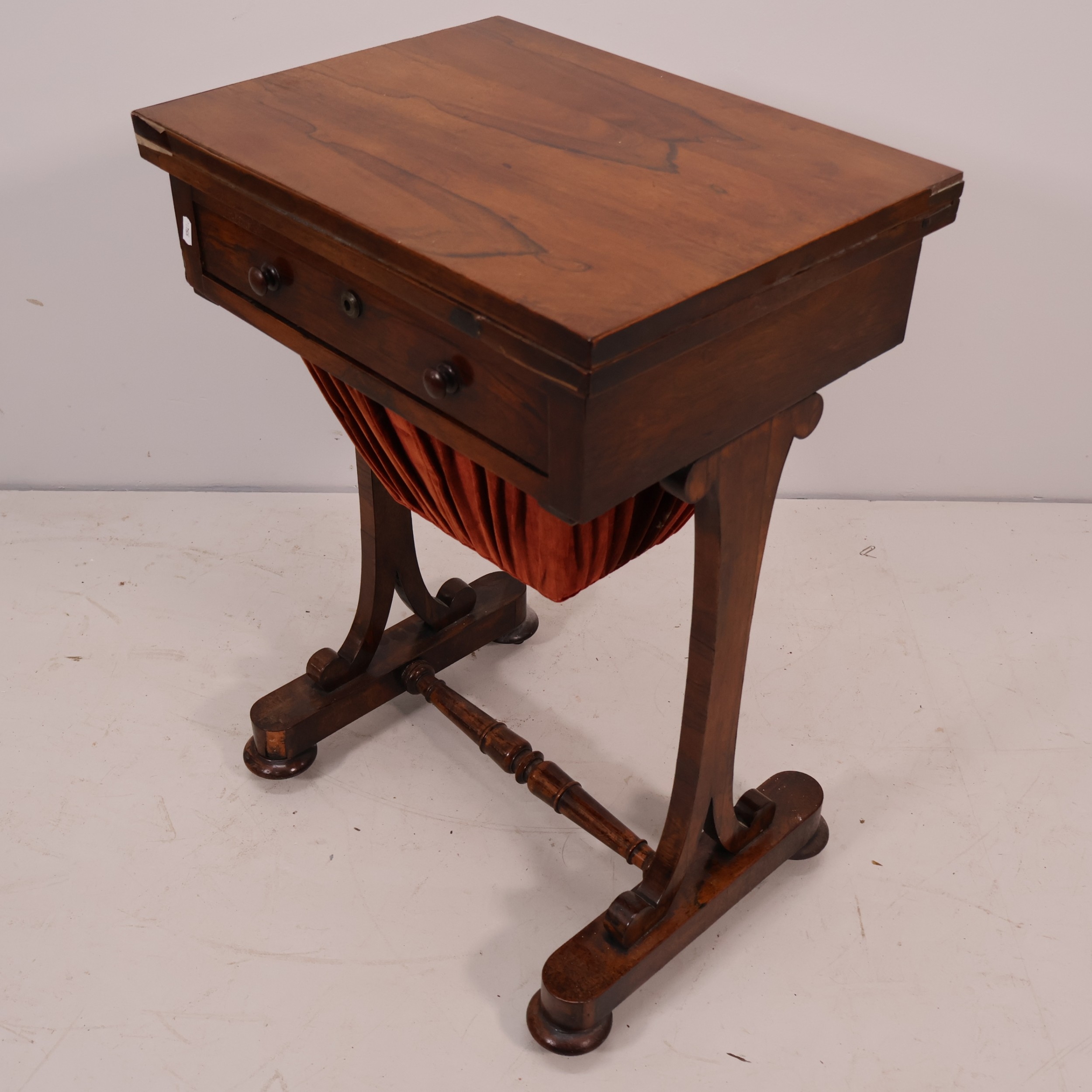 A Regency rosewood sewing table, with fold-over top, single drawer and ...