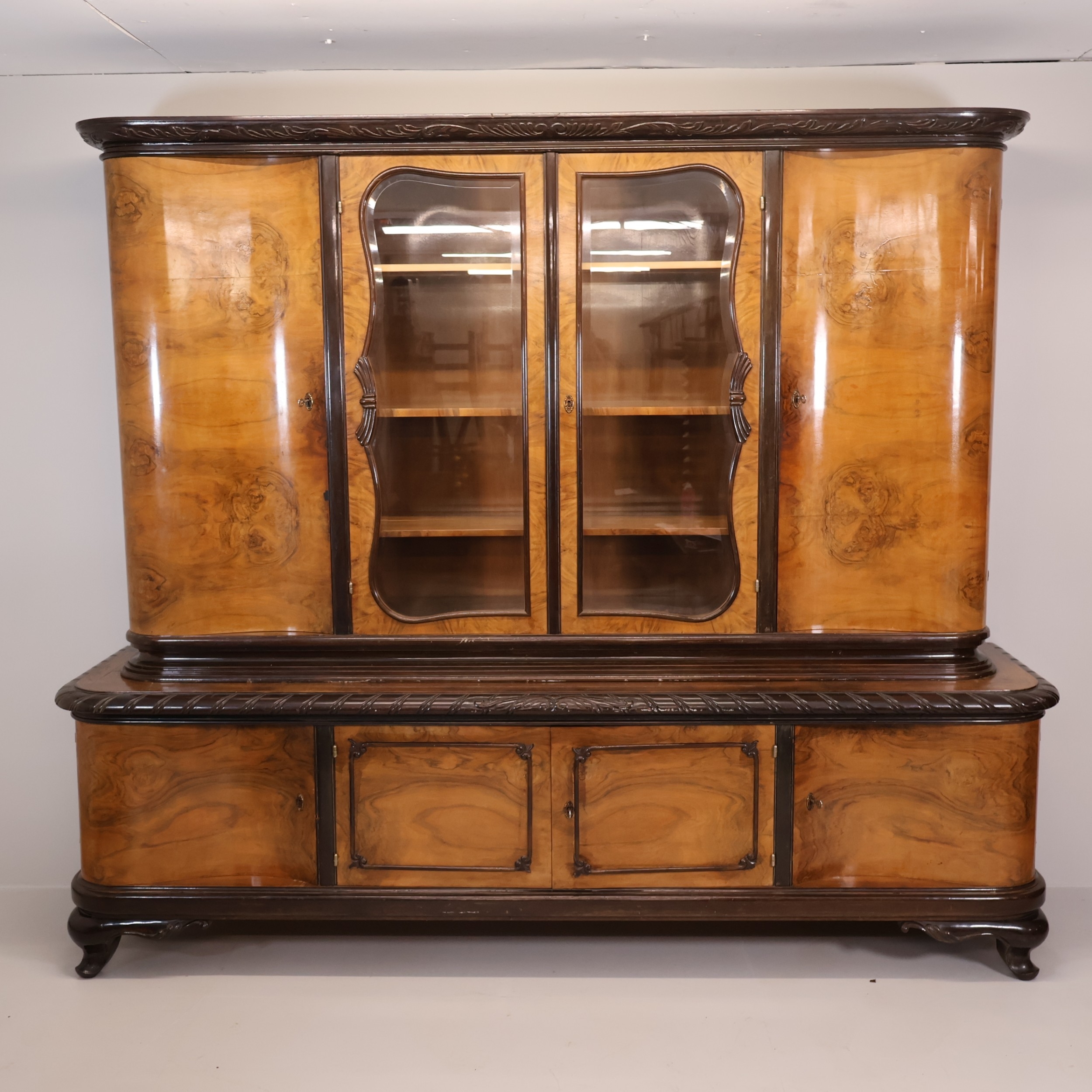A German Biedermeier style oak and burr-walnut veneered two-section ...