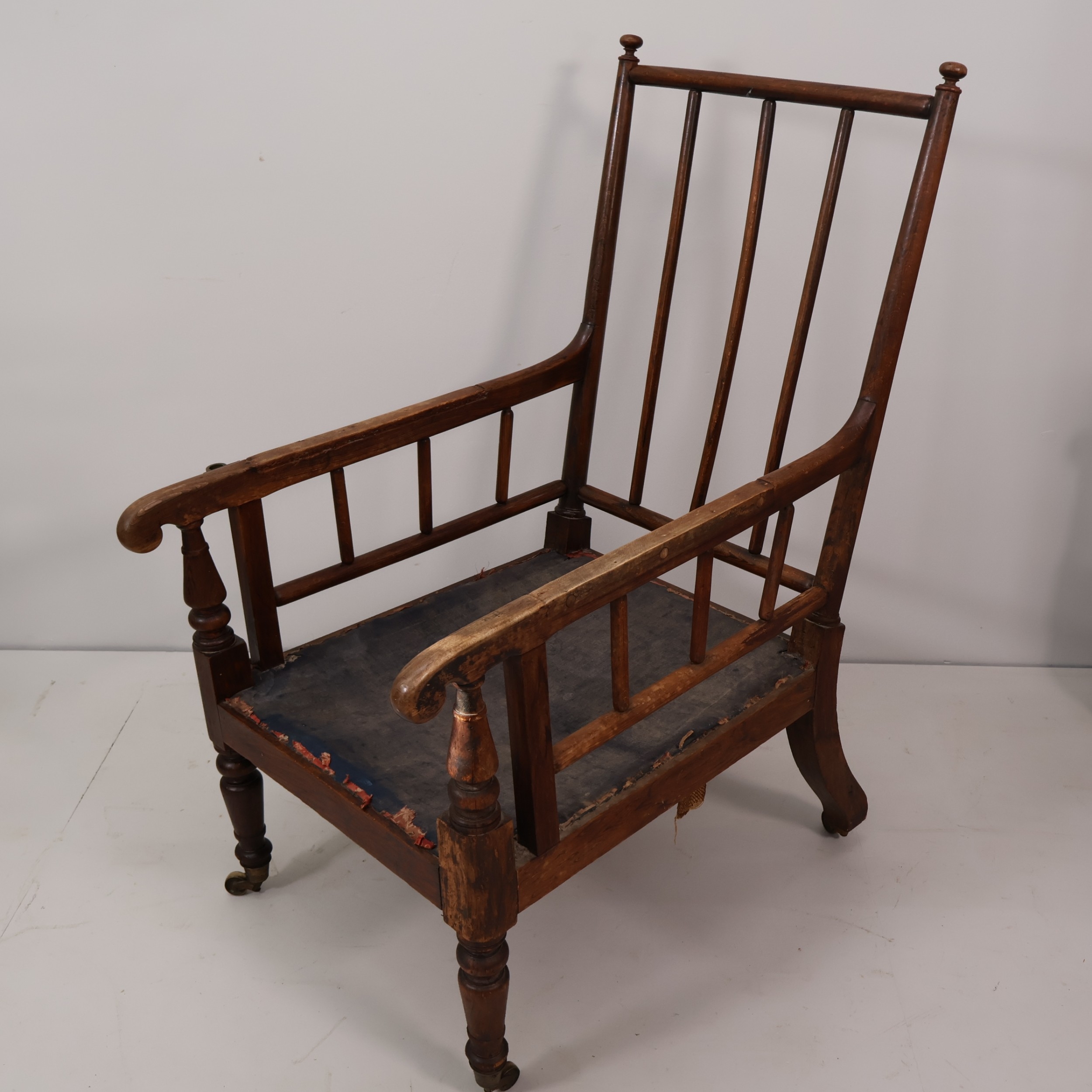 A Regency period stick and rail back library lounge chair in simulated ...