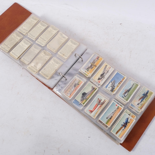 An album of cigarette cards, many complete sets, these issued by John ...
