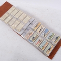 An album of cigarette cards, many complete sets, these issued by John ...
