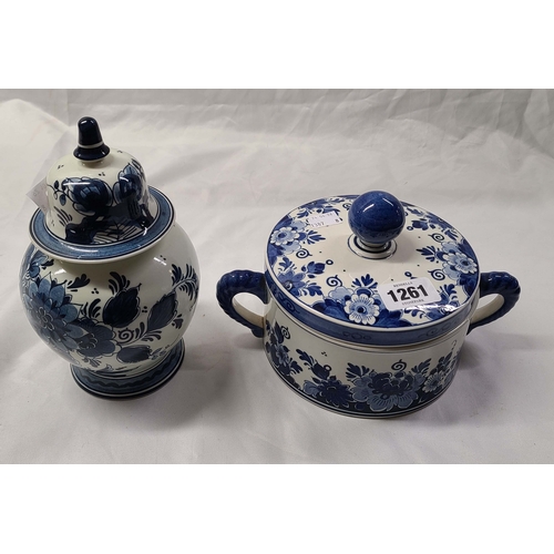1261 - A Dutch Delft lidded jar with blue hand painted floral decoration - sold with a similar two-handled ... 