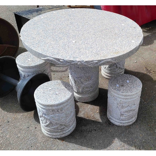 13 - A polished granite garden patio set comprising a circular table set on a carved pedestal base and fo... 