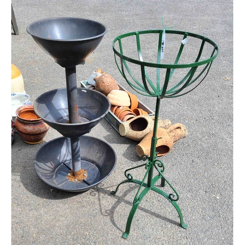 16 - A decorative wrought metal floor standing garden planter with basket form top and later green painte... 