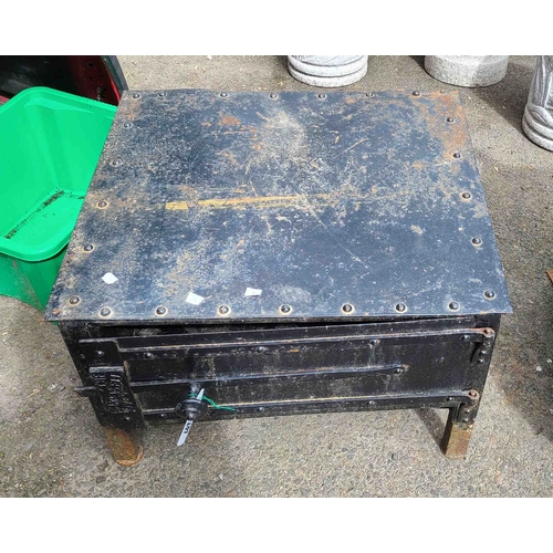 18 - A low cast iron garden oven stamped 'The Bakewell Oven' - door latch a/f