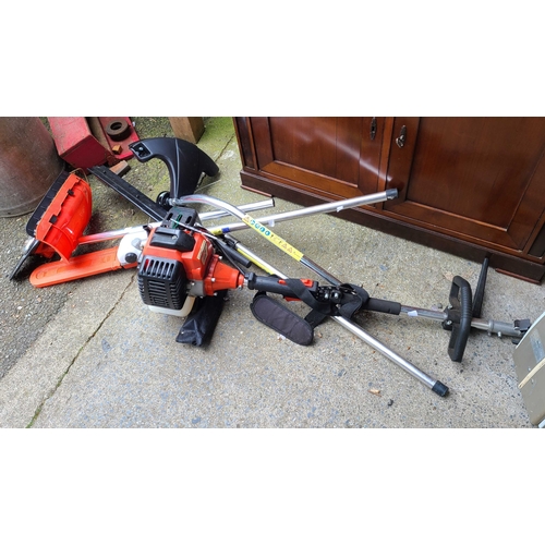 22 - A Fox brand 'Garden Commander' 4 in 1 petrol multi-tool with attachments