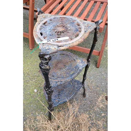 37 - A three tier decorative cast iron pot stand
