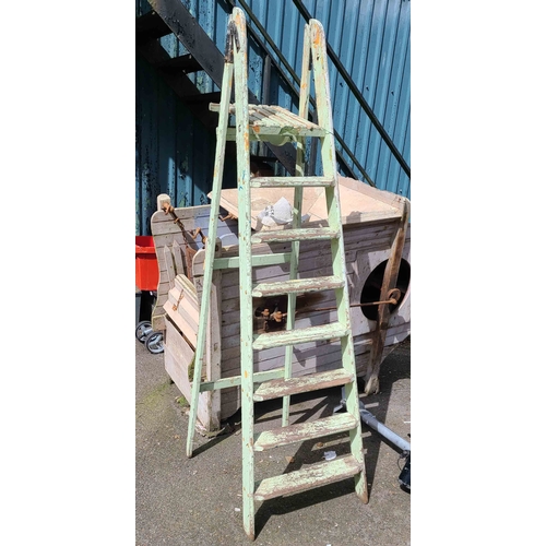 8 - A wooden folding stepladder with remains of painted finish