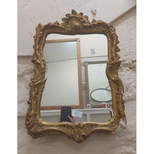 351 - A vintage painted wood framed bevelled oval wall mirror with carved fruit border - sold with a gilt ... 
