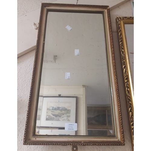 356 - An ornate gilt framed bevelled oblong wall mirror - some loss - sold with a parcel gilt oblong simil... 