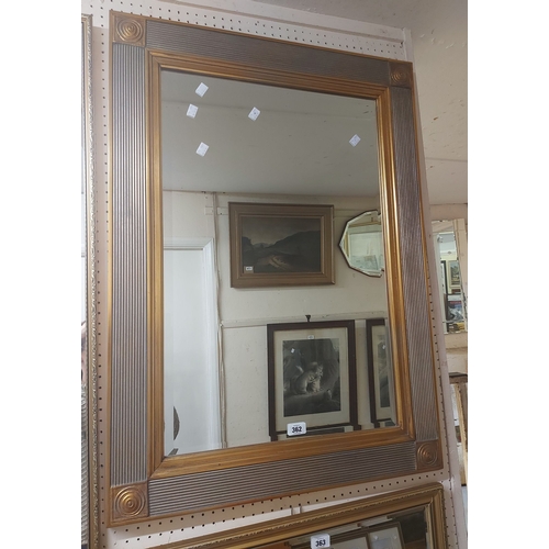 362 - A large gilt framed bevelled oblong wall mirror with reeded border
