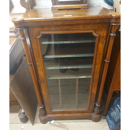 372 - A 57cm Victorian figured walnut and strung music cabinet with labelled shelves and compartments encl... 