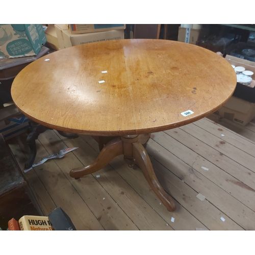 386 - A 99cm diameter antique pine tilt-top pedestal table, set on turned pillar and tripod base