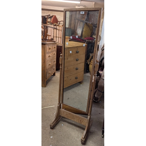 306 - An early 20th Century limed oak cheval mirror with oblong plate - attributed to Heals