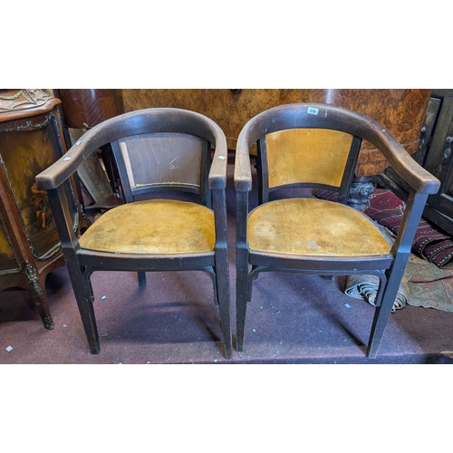 318 - A pair of early 20th Century stained bentwood framed bow elbow chairs with old gold velour upholster... 