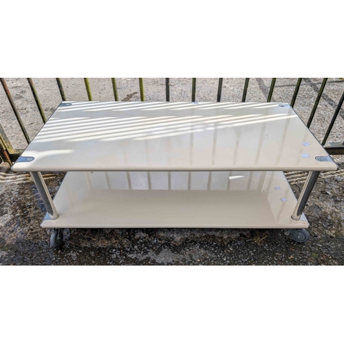 322 - A 99cm 1984 Habitat white painted metal two tier coffee table, set on castors