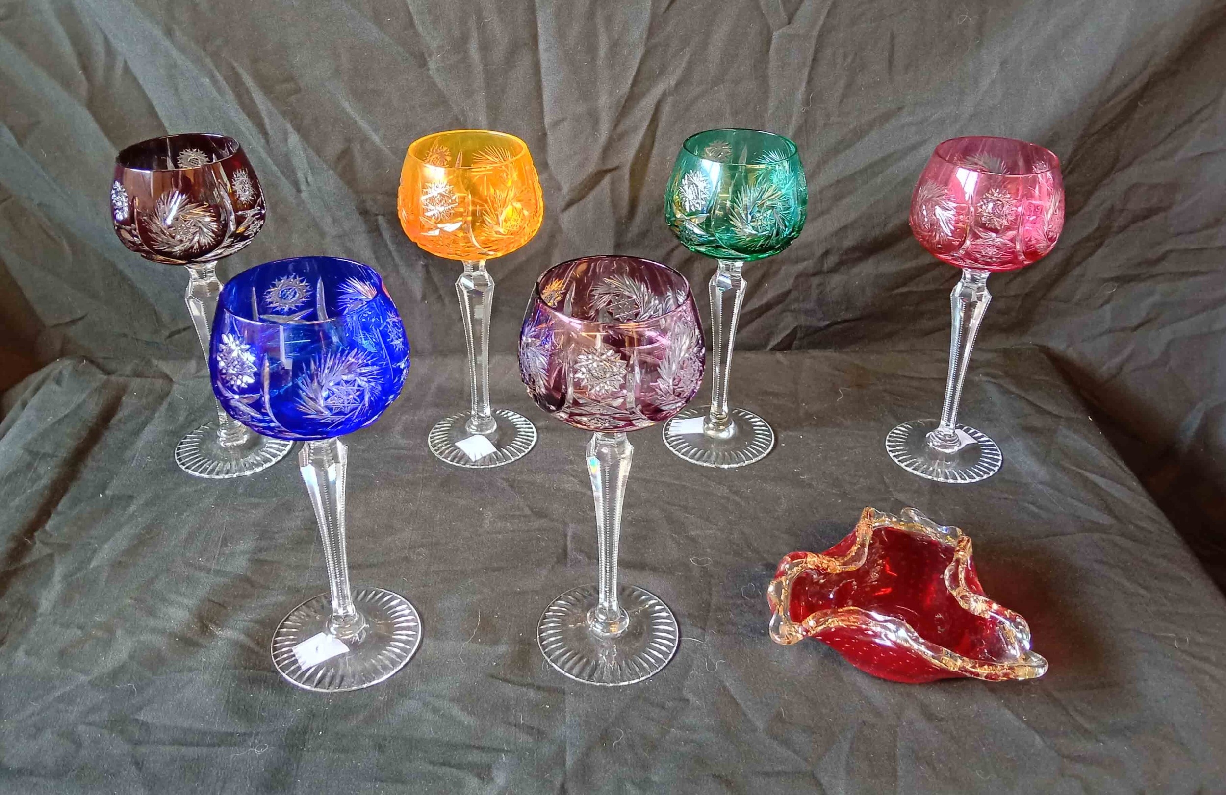 A set of six Bohemian glass hocks with cased and cut 'harlequin' bowls ...