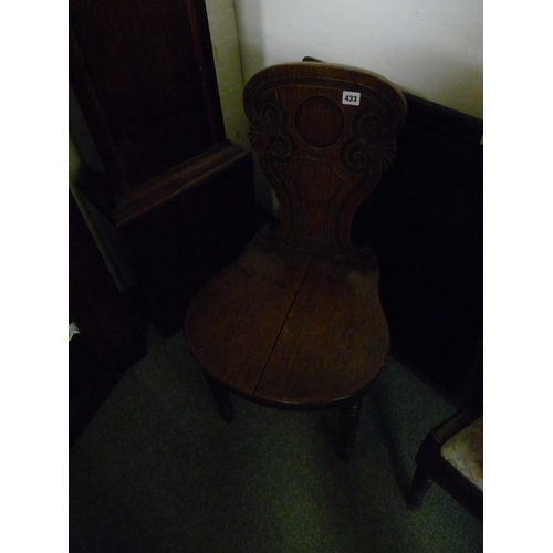 433 - Oak carved hall chair on turned supports