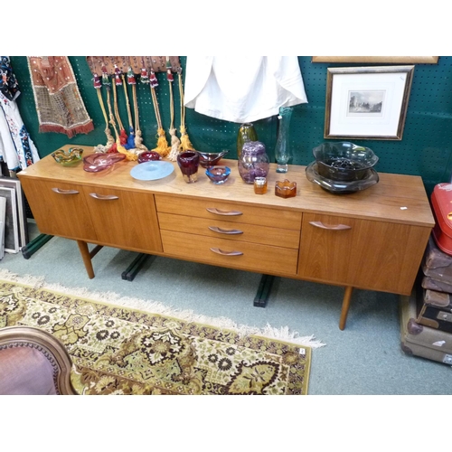 257 - 1970s Long Sideboard of 3 drawers flanked by 2 Cupboards, supported on tapering legs