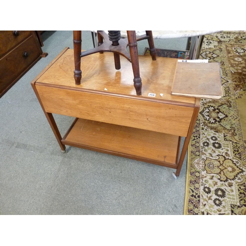 259 - Teak drop leaf buffet trolley with under tier supported on casters