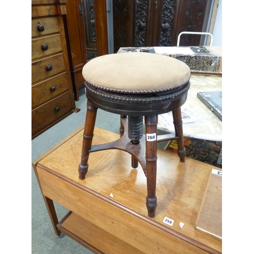 260 - Late 19thC upholstered revolving adjustable piano stool on cruciform support and splayed turned legs